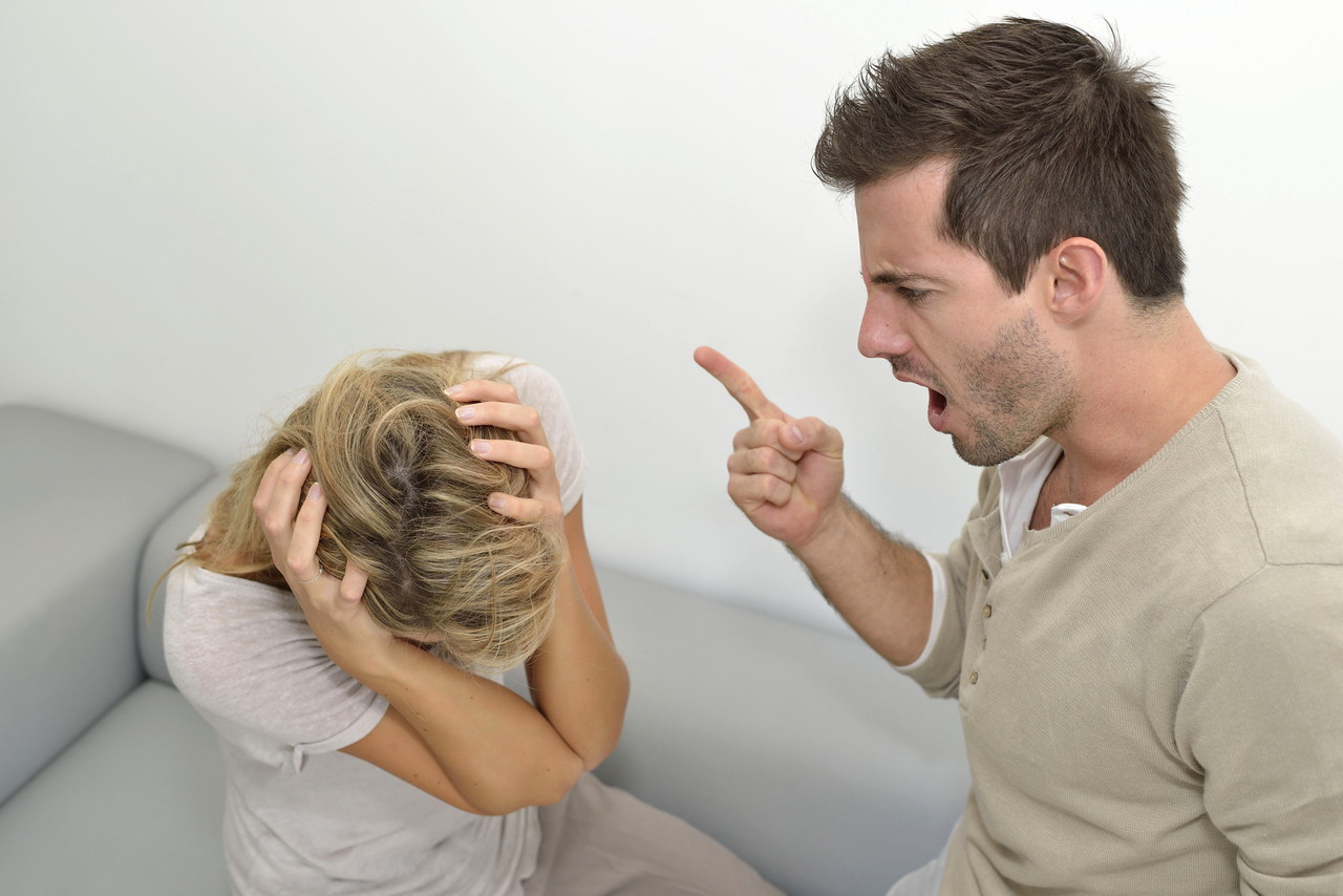 Man being angry at woman and using violence